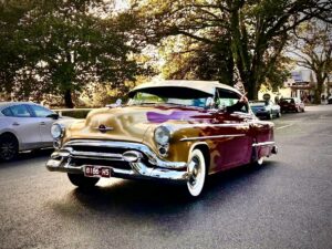 1953 Oldsmobile Super 88 holiday coupe Burgundy with gold flames - Main Photo